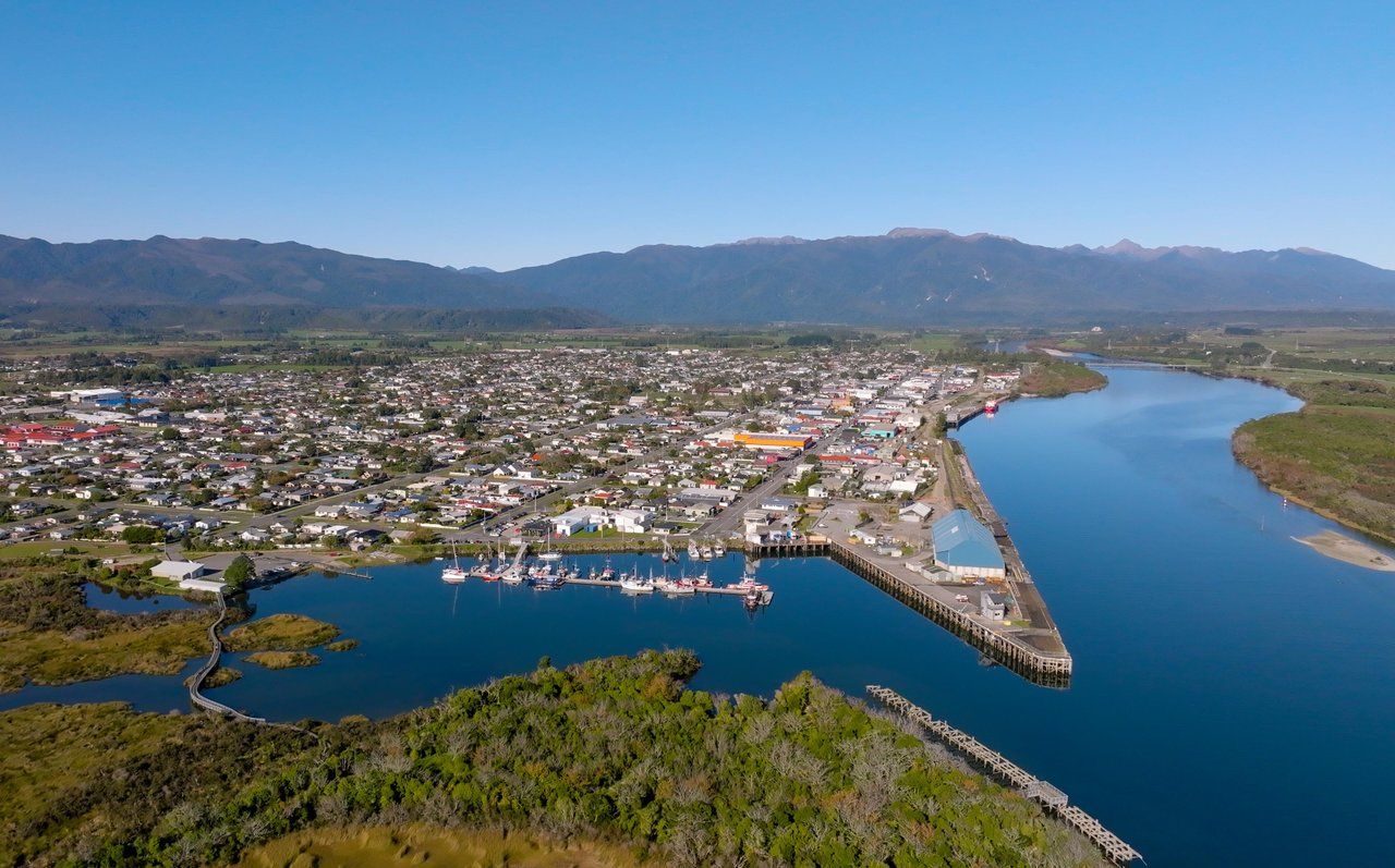 Aerial view of the Port of Westport, the fishing fleet and the river mouth.